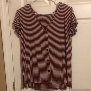 This is a striped blouse from Sweet Claire’s